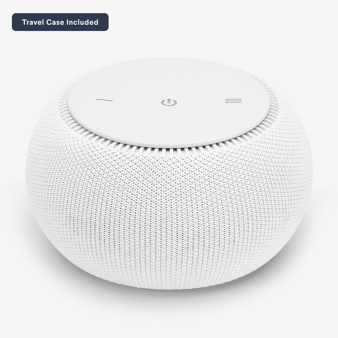 White, round portable speaker with a simple design.